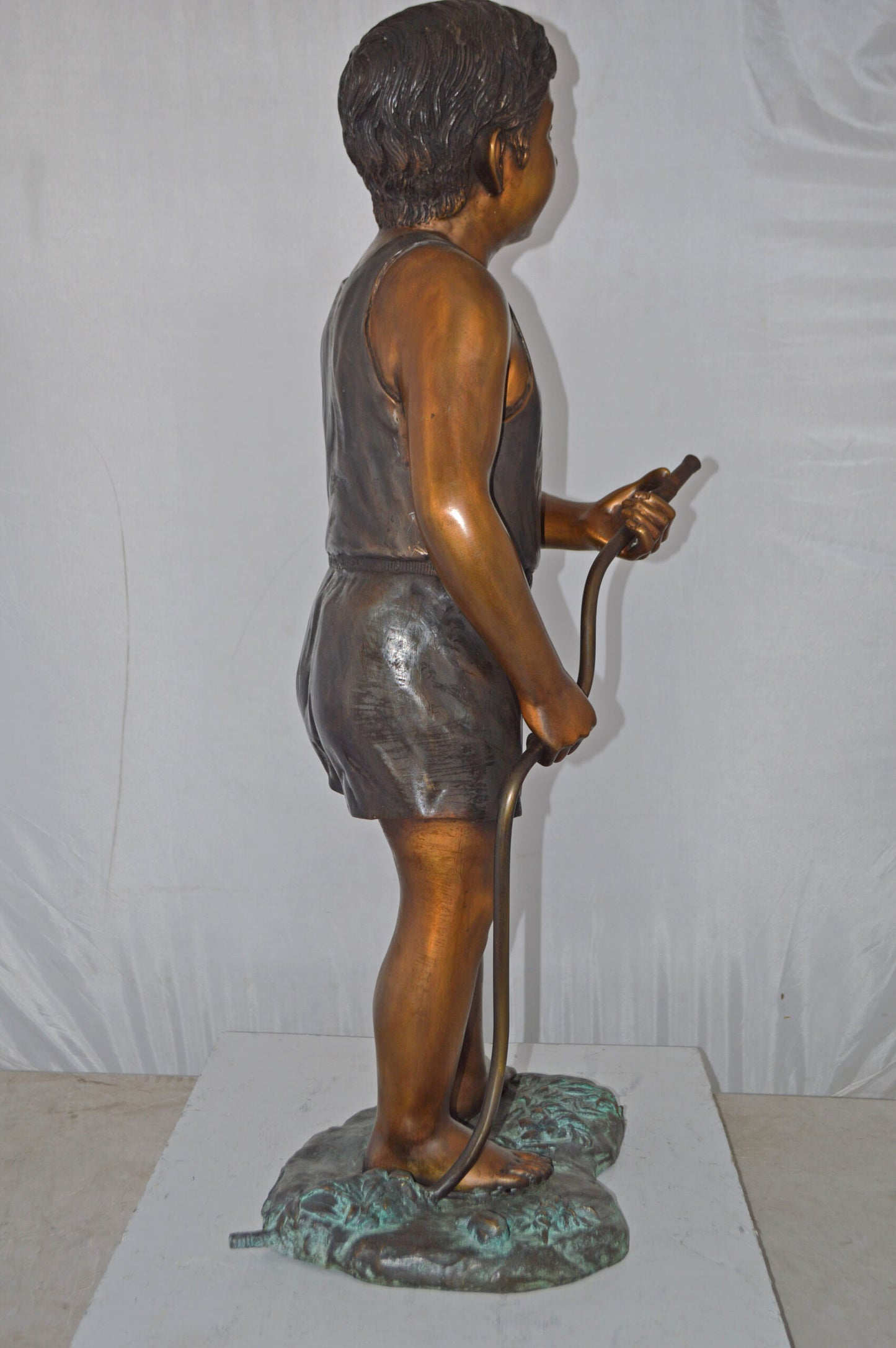 A Boy Holding A Garden Hose Bronze Statue Fountain - Size: 13"L x 20"W x 39"H.