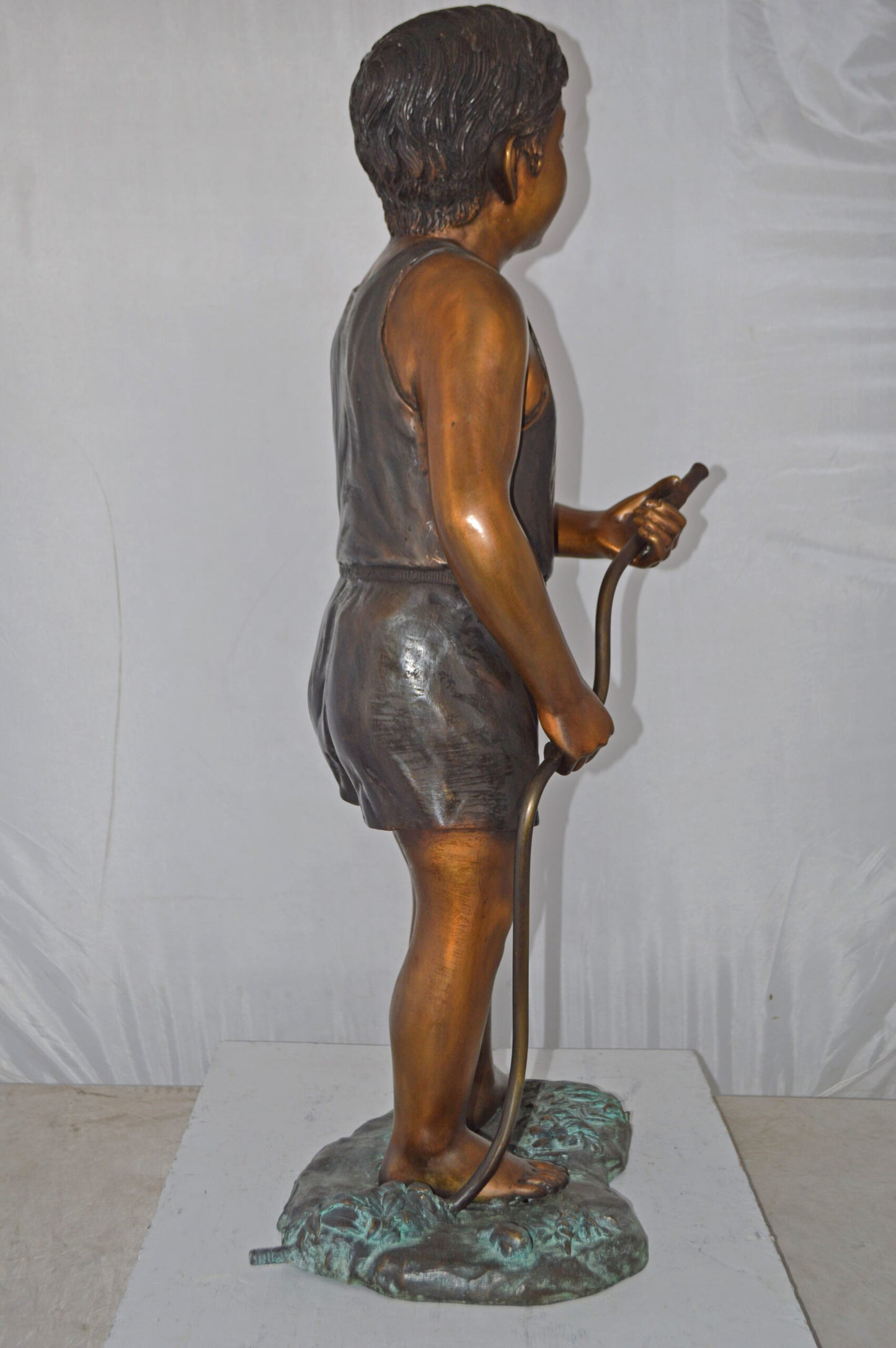 A Boy Holding A Garden Hose Bronze Statue Fountain - Size: 13"L x 20"W x 39"H.