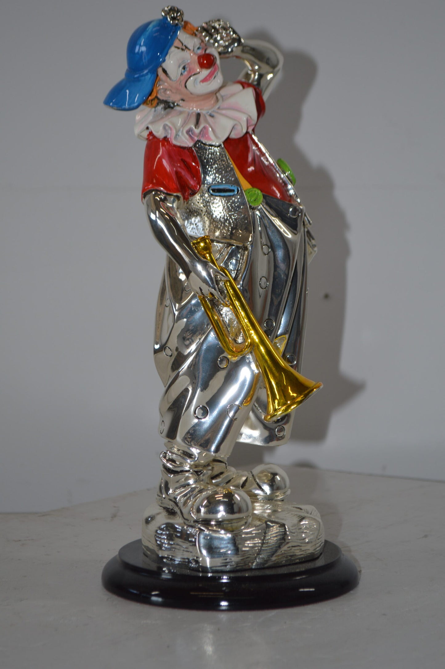 Clown plays Trumpet Resin Statue Silver finish - Size: 6"L x 6"W x 17"H.
