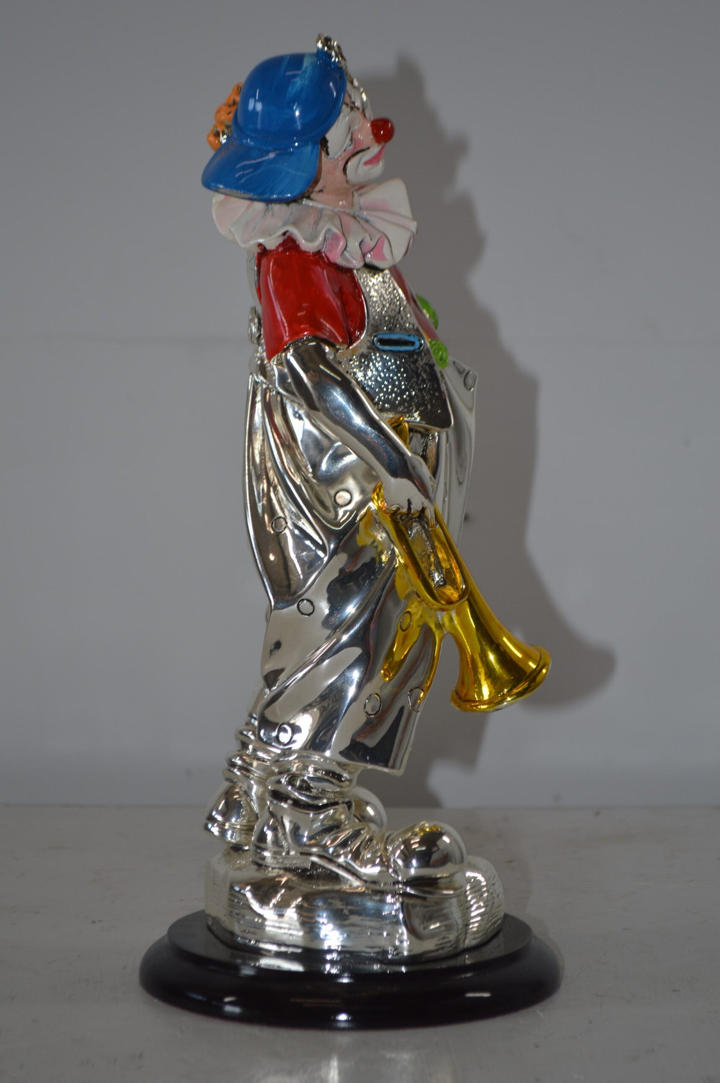 Clown plays Trumpet Resin Statue Silver finish - Size: 6"L x 6"W x 17"H.