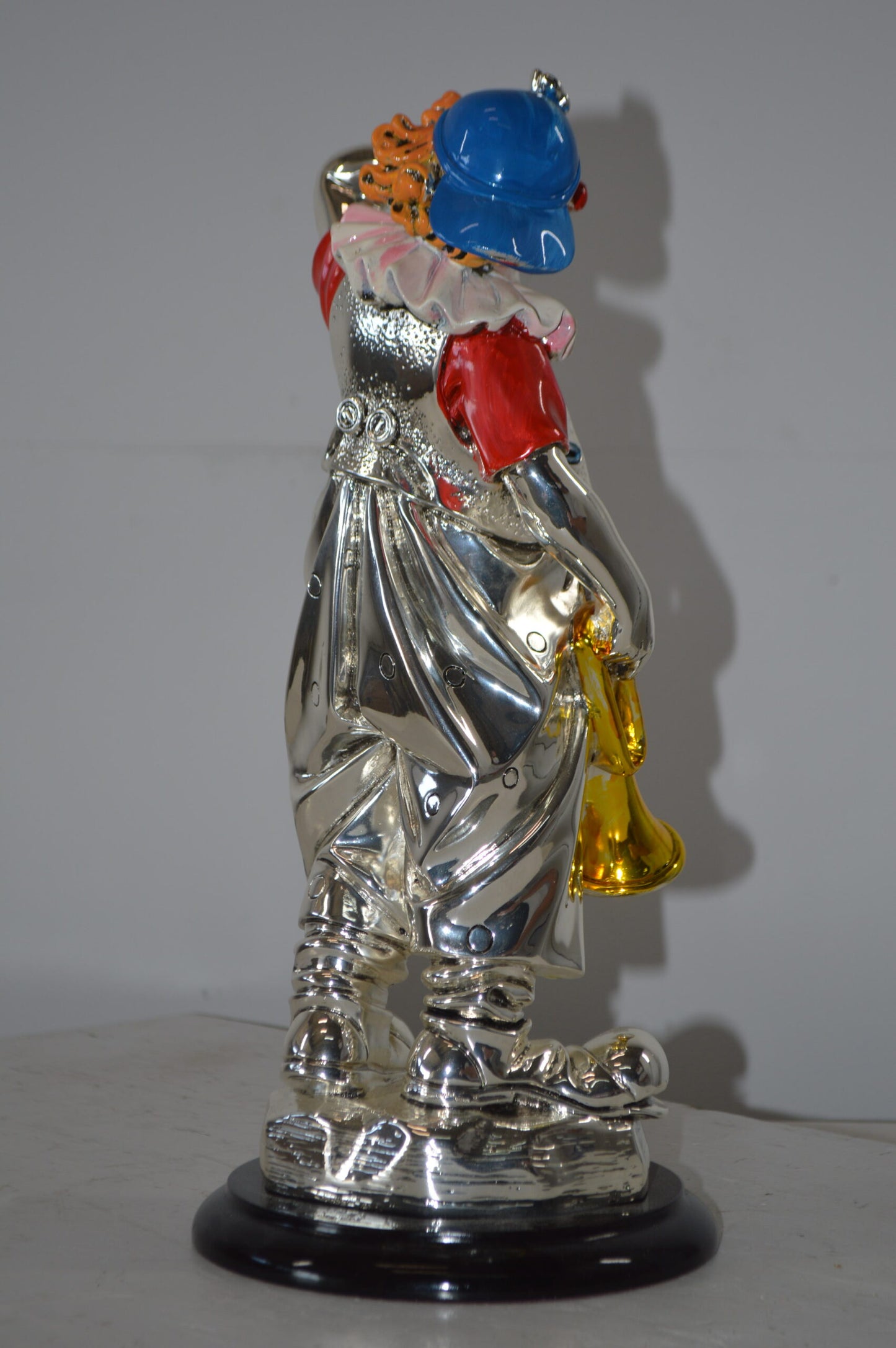 Clown plays Trumpet Resin Statue Silver finish - Size: 6"L x 6"W x 17"H.