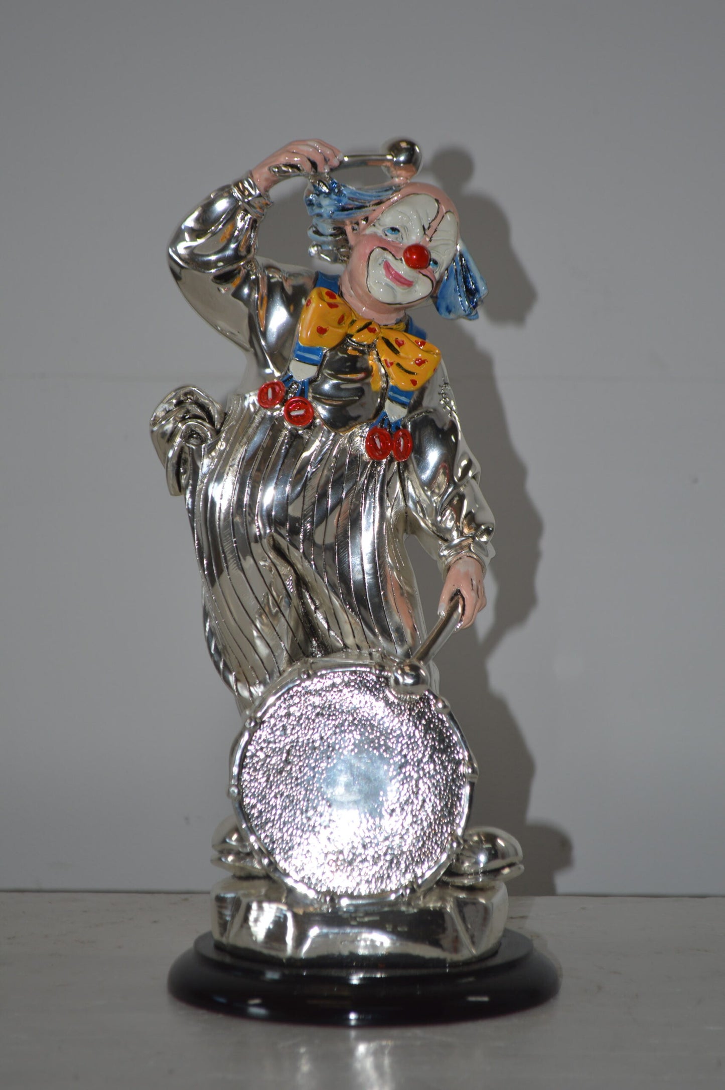 Clown Plays the Drams Resin Statue Silver finish - Size: 6"L x 6"W x 16"H.