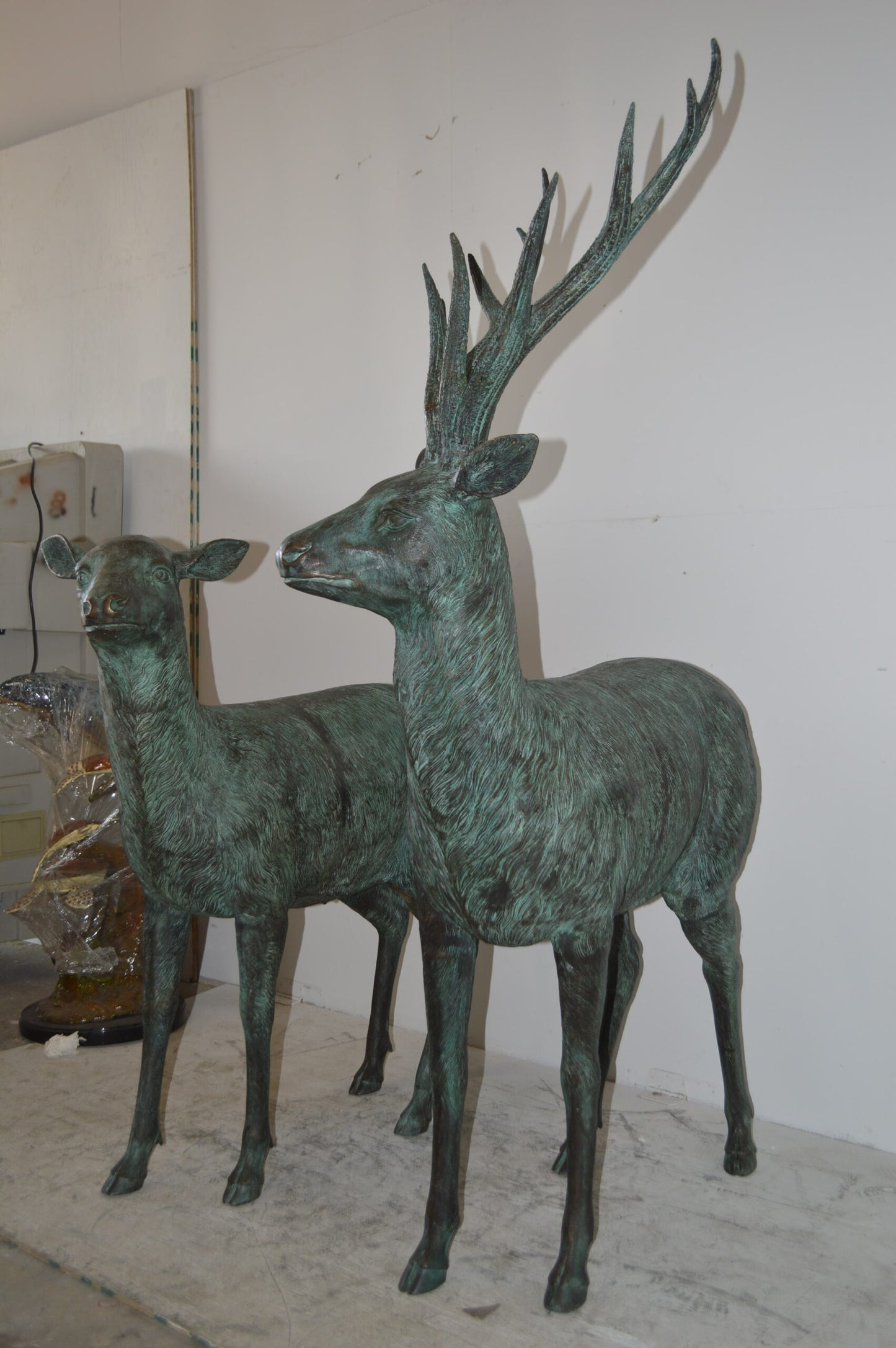 Pair of life size deer bronze statue with Green Patina - Size: 17" x 44" x 52"H.