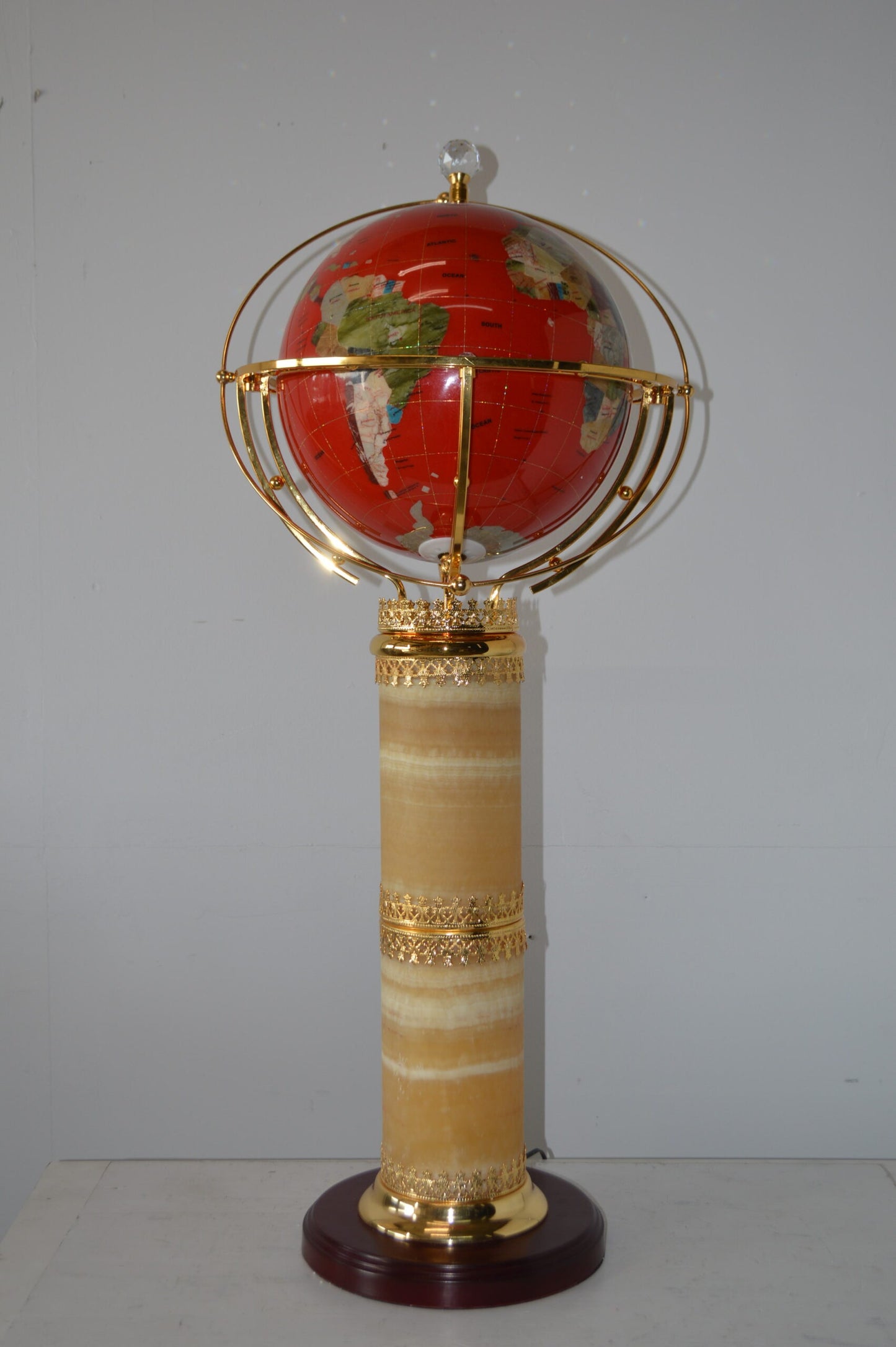 Illuminated Red - World Globe Rotated by a Motor - Size: 19"L x 19"W x 42"H.