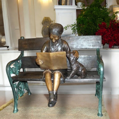 Girl sitting with her dog  on a bench,  reading Bronze Statue - 27" x 39" x 32"H