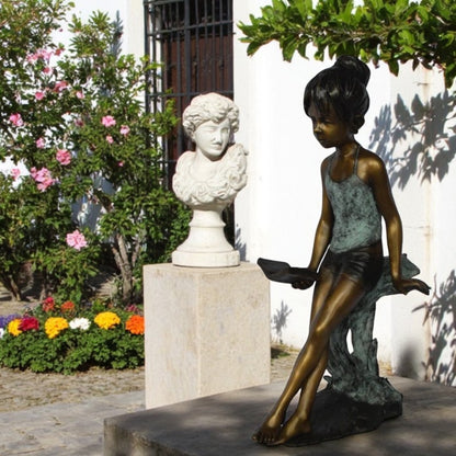 Girl sitting and reading a book bronze statue -  Size: 19"L x 15"W x 36"H.