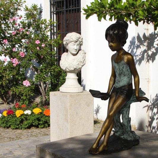 Girl sitting and reading a book bronze statue -  Size: 19"L x 15"W x 36"H.