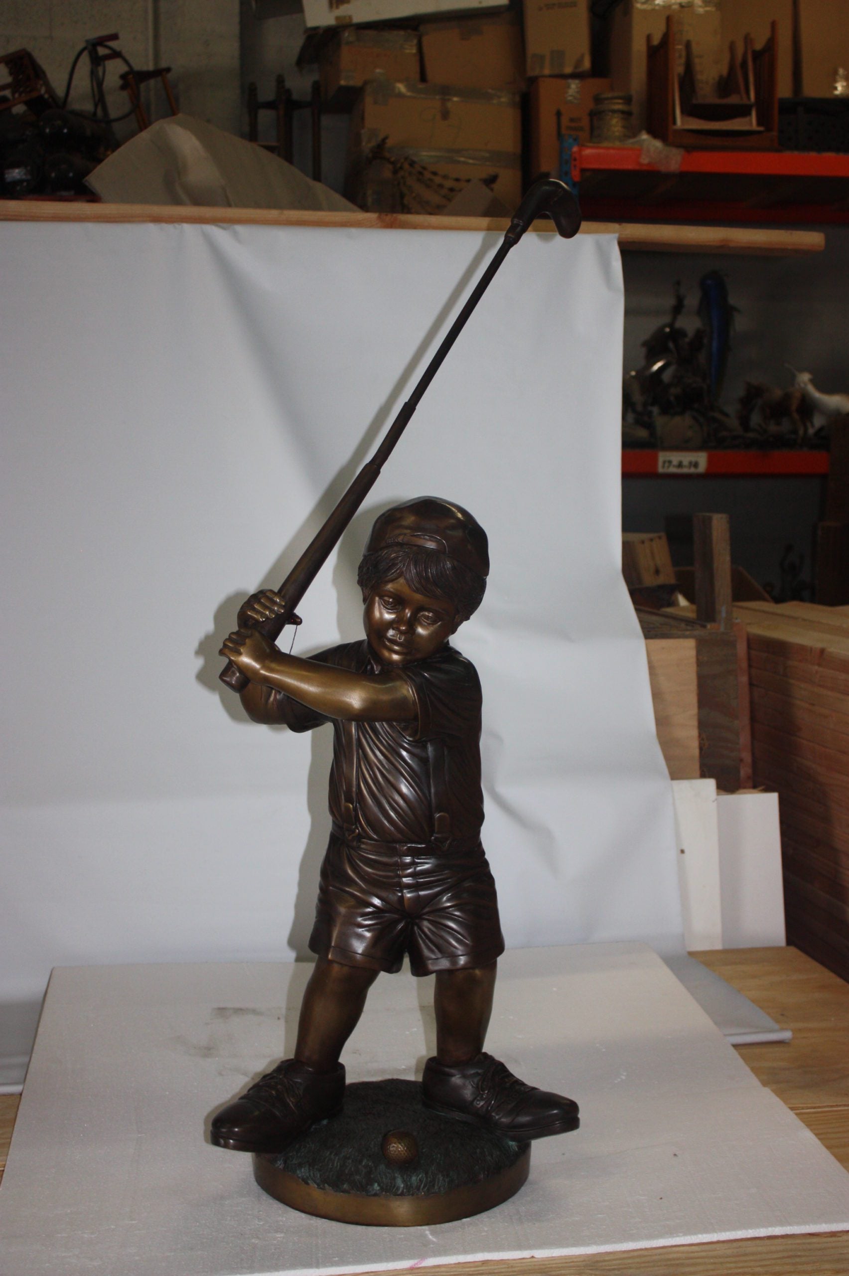 Golfer Boy Bronze - Big shoes -  Size: 18"L x 14"W x 49"H. 