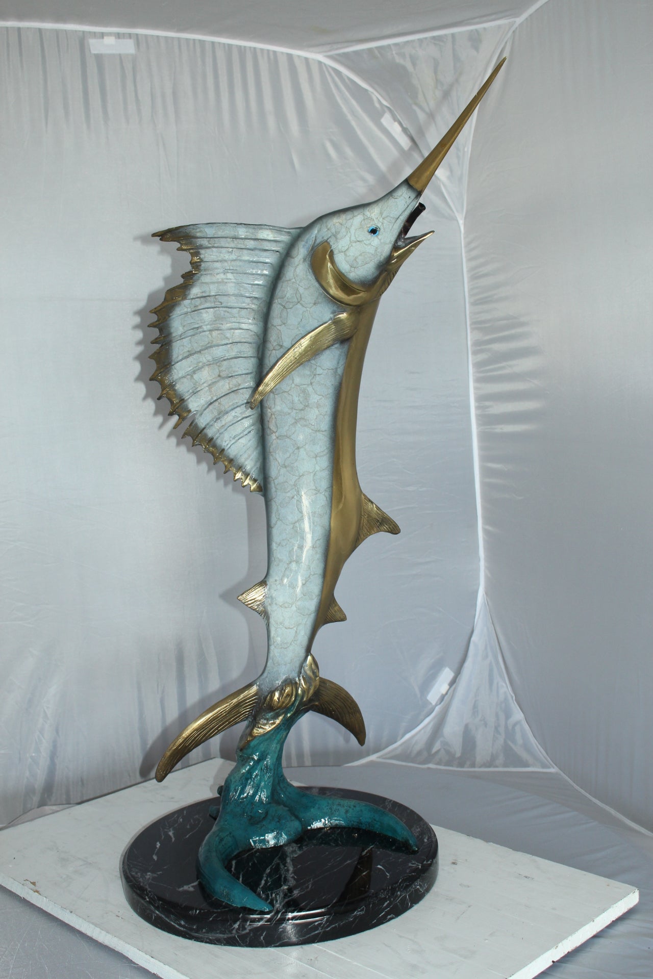 One Sailfish Jumping of the ware - Bronze Statue -  Size: 16"L x 16"W x 39"H. 