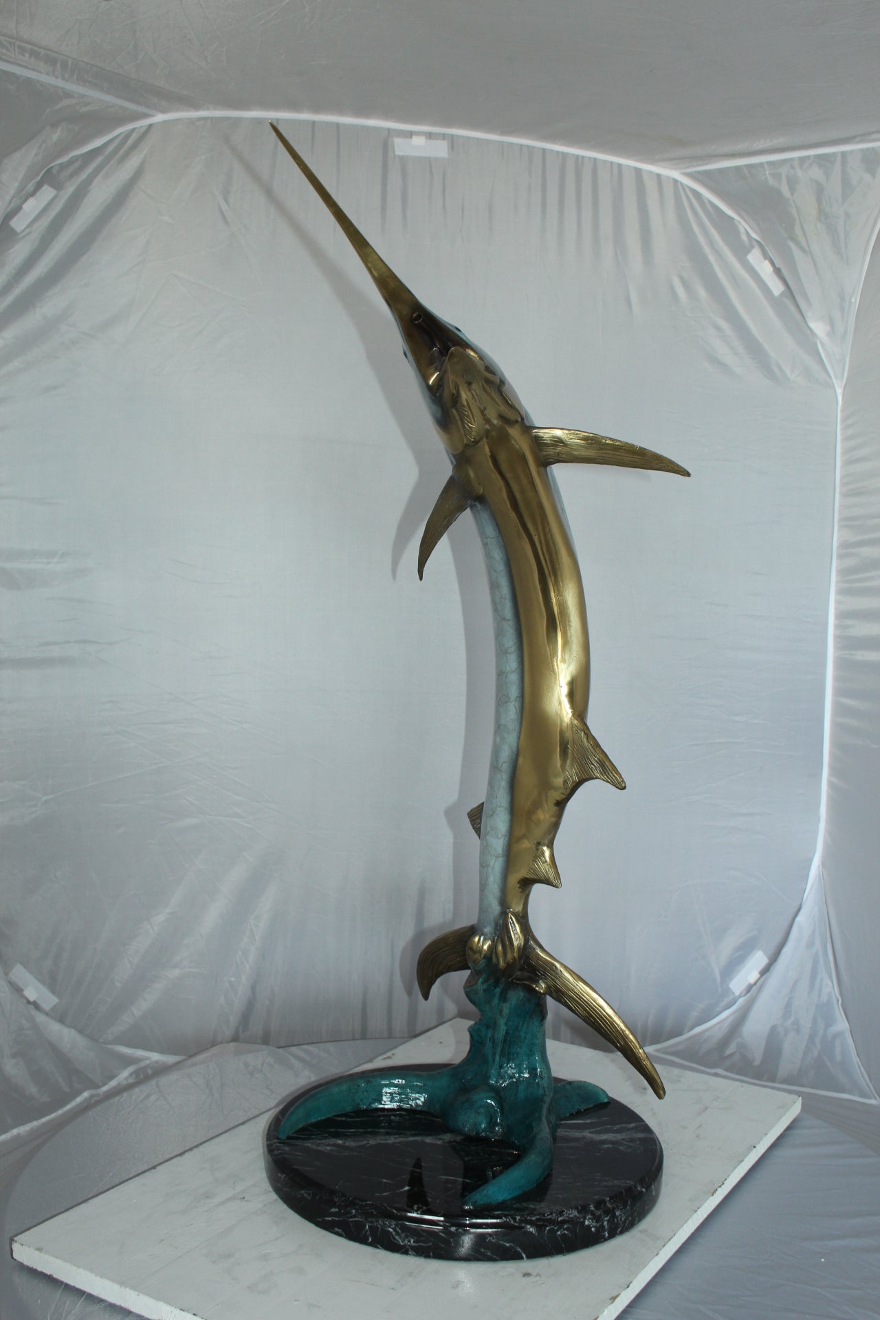 One Sailfish Jumping of the ware - Bronze Statue -  Size: 16"L x 16"W x 39"H. 
