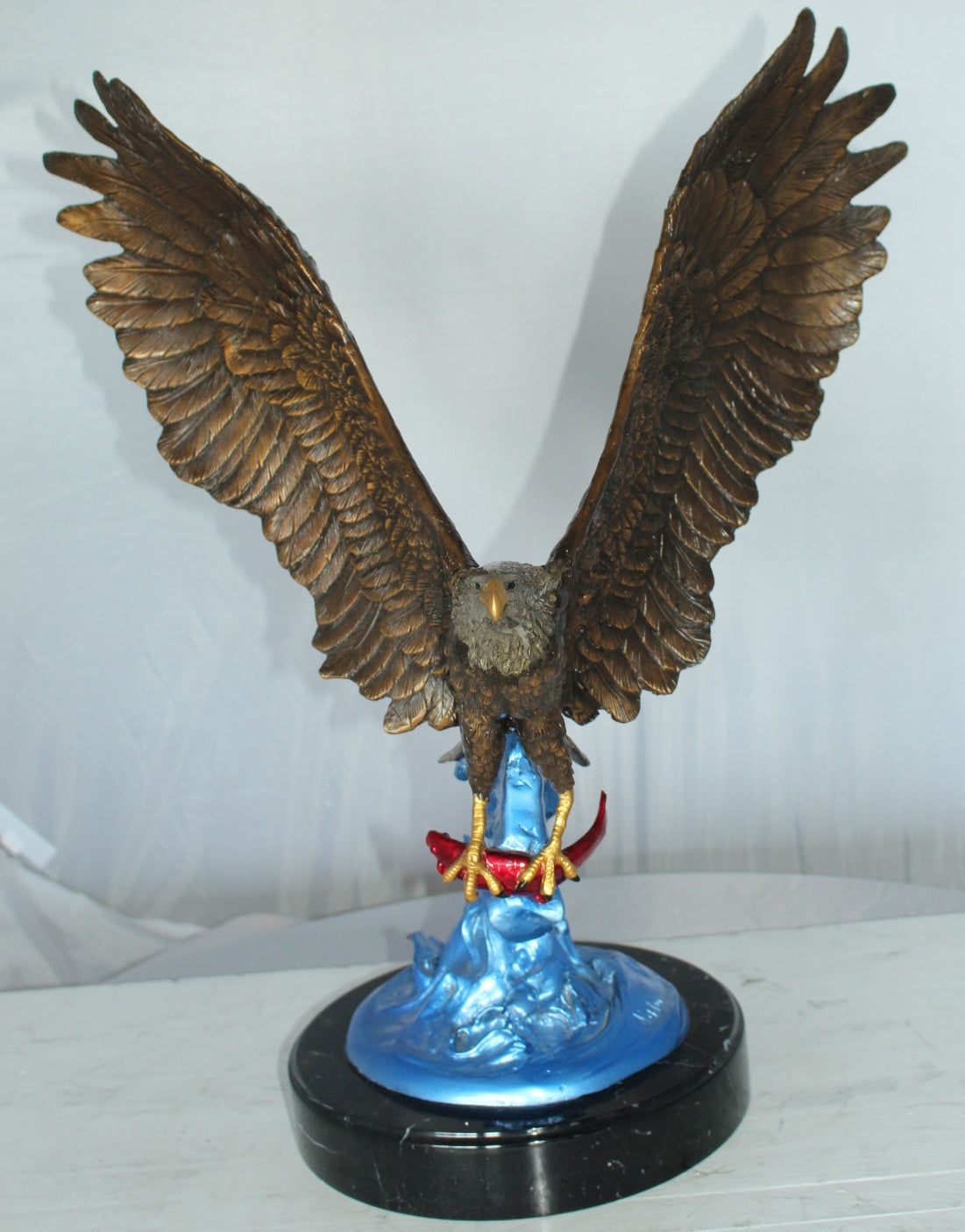 Eagle Catching his Prey Bronze Statue -  Size: 17"L x 20"W x 25"H. 