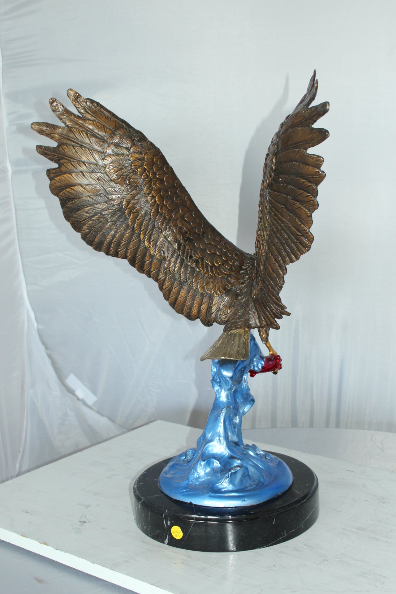 Eagle Catching his Prey Bronze Statue -  Size: 17"L x 20"W x 25"H. 