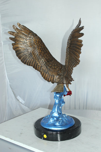 Eagle Catching his Prey Bronze Statue -  Size: 17"L x 20"W x 25"H. 