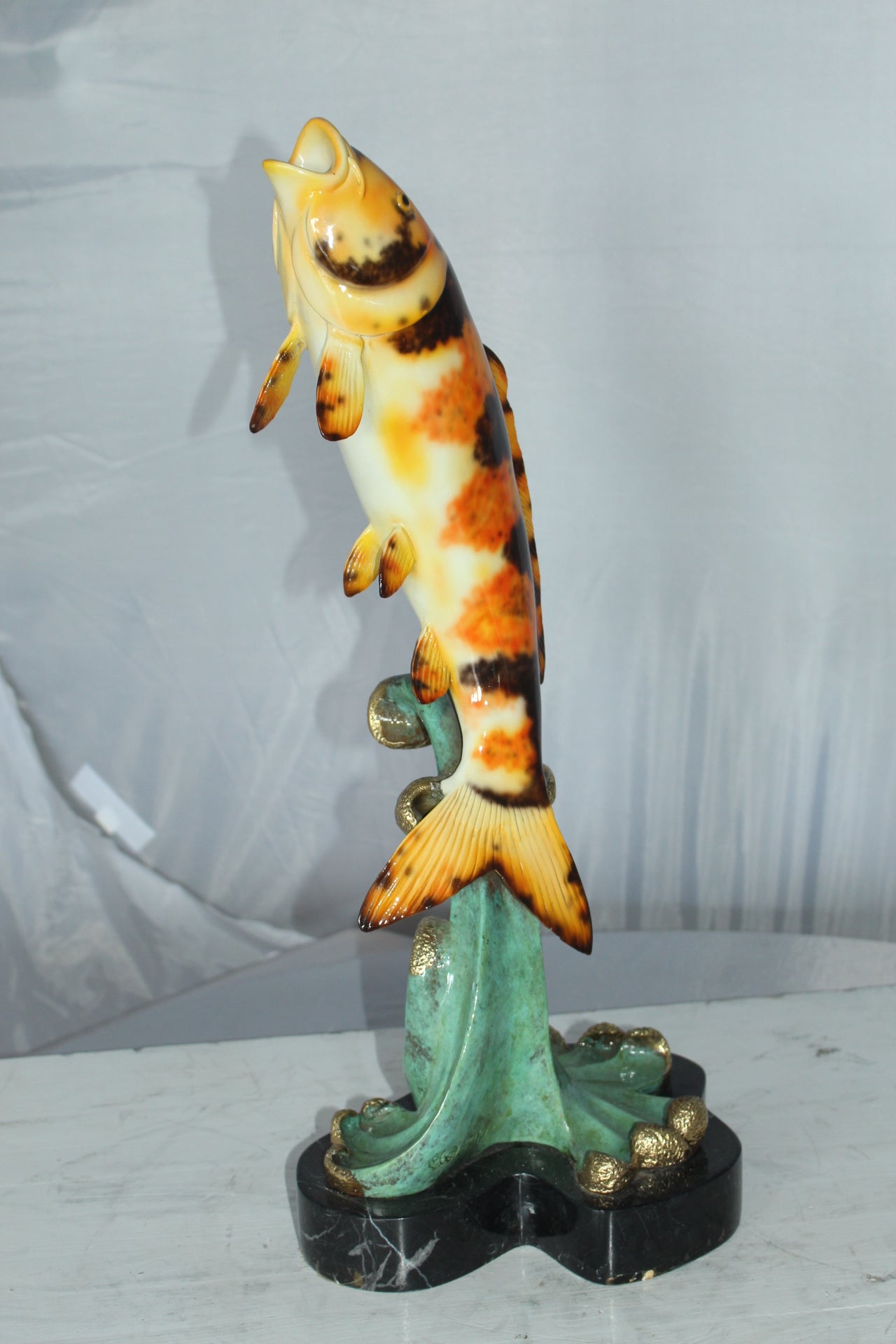 Coy Fish Jumping off the Water Bronze Statue -  Size: 10"L x 9"W x 22"H. 
