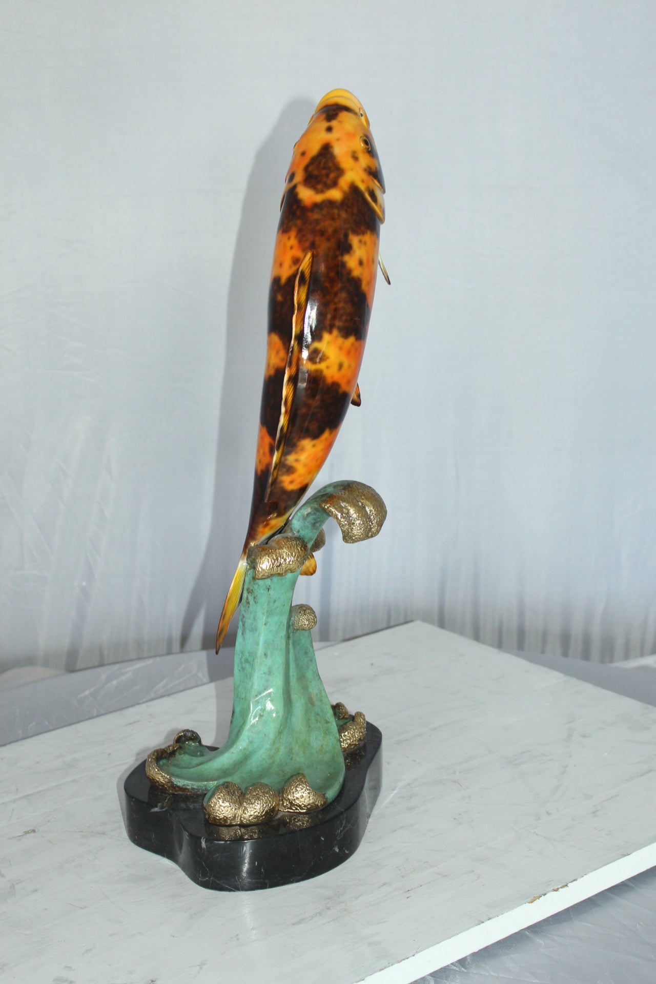 Coy Fish Jumping off the Water Bronze Statue -  Size: 10"L x 9"W x 22"H. 