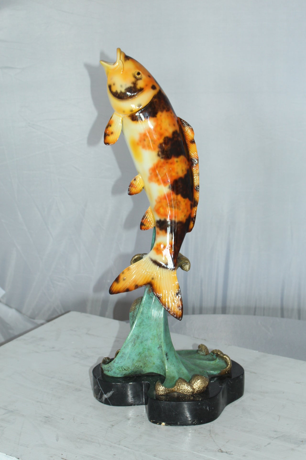 Coy Fish Jumping off the Water Bronze Statue -  Size: 10"L x 9"W x 22"H. 