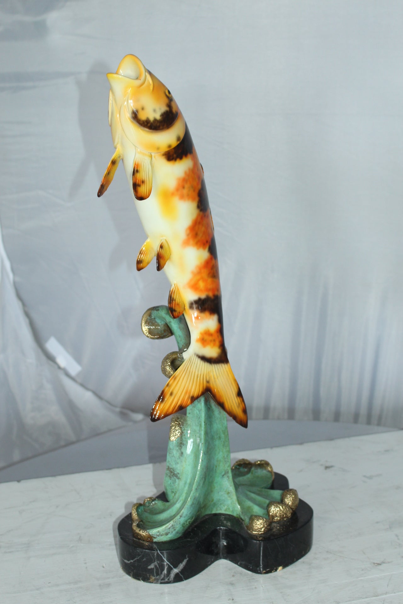 Coy Fish Jumping off the Water Bronze Statue -  Size: 10"L x 9"W x 22"H. 