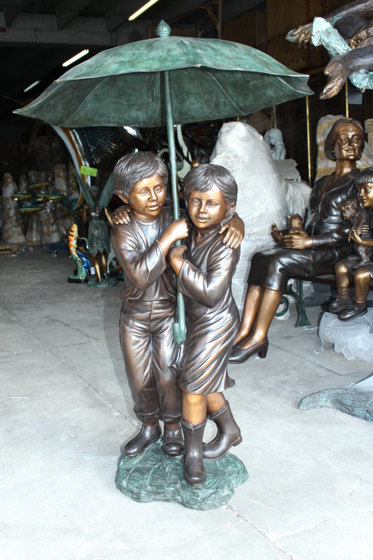 Two Kids Holding an Umbrella - Bronze Statue - Fountain -  90"L x 34"W x 90"H. 