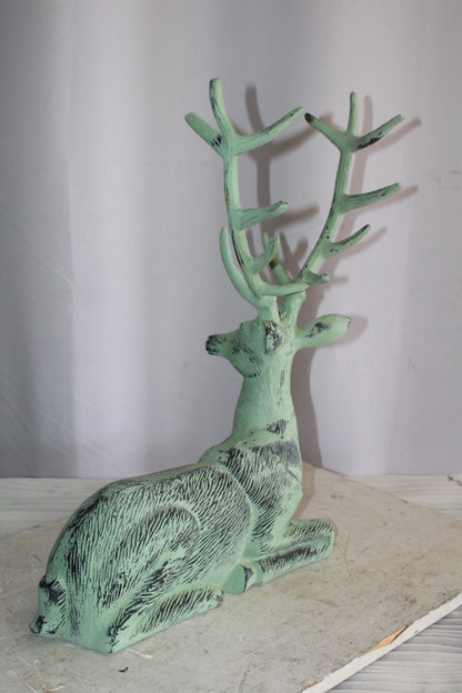 Aluminum Deer Statue Green Patina Resting on the ground 26" x 7" x 24"H