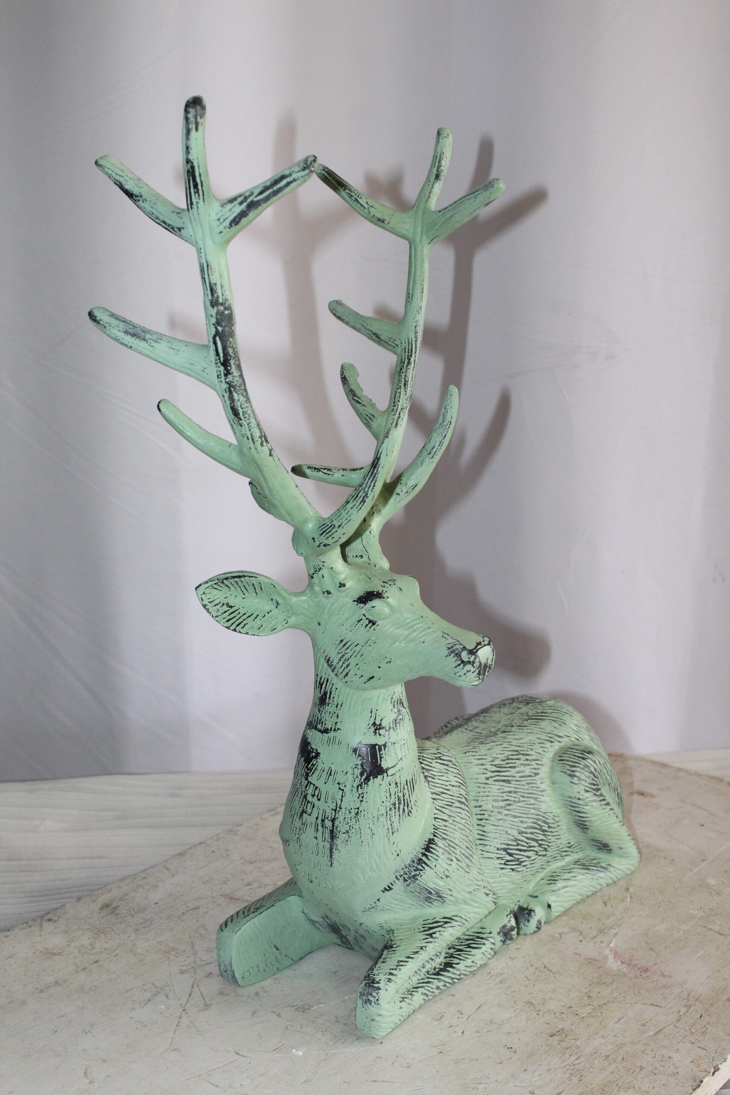 Aluminum Deer Statue Green Patina Resting on the ground 26" x 7" x 24"H