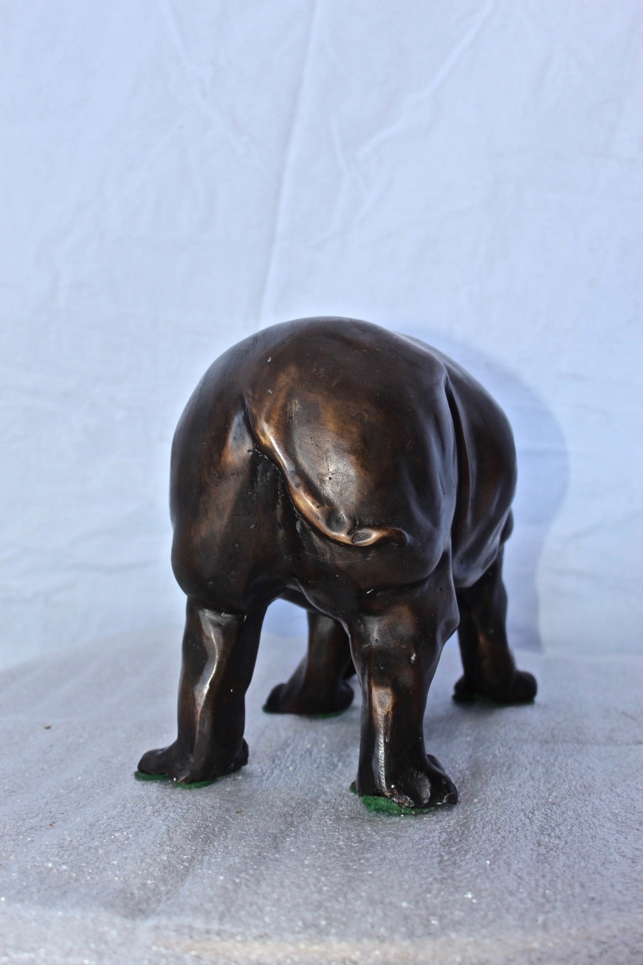 Relaxed Rhino bronze statue -  Size: 16"L x 9"W x 8"H.