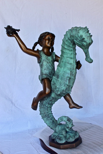 Boy and girl riding seahorses bronze fountain -  Size: 18"L x 23"W x 38"H.