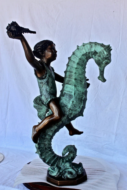 Boy and girl riding seahorses bronze fountain -  Size: 18"L x 23"W x 38"H.
