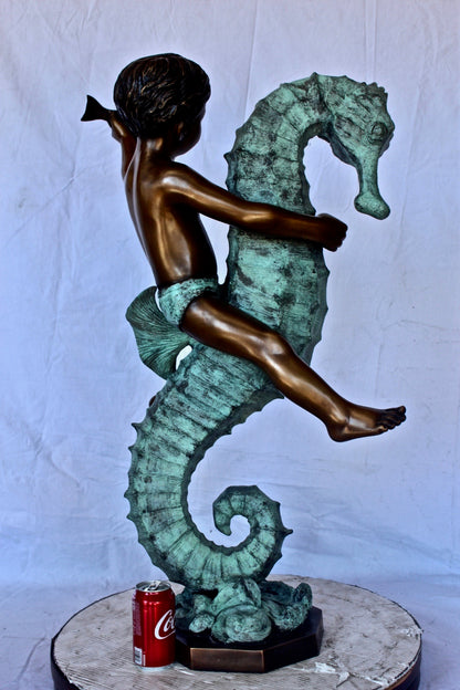 Boy and girl riding seahorses bronze fountain -  Size: 18"L x 23"W x 38"H.