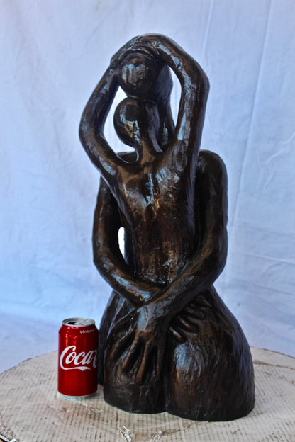 Lovers embracing one another bronze statue -  Size: 13"L x 10"W x 24"H.