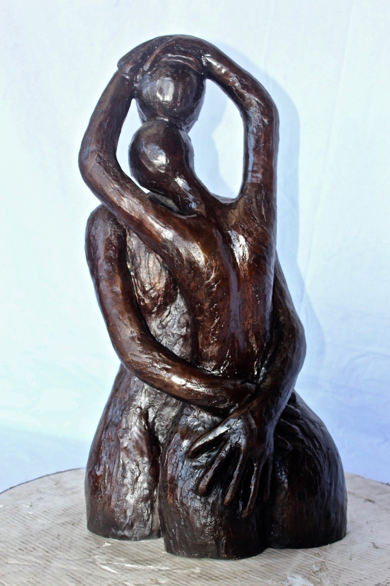 Lovers embracing one another bronze statue -  Size: 13"L x 10"W x 24"H.
