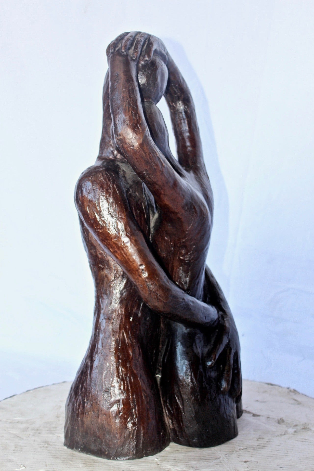Lovers embracing one another bronze statue -  Size: 13"L x 10"W x 24"H.