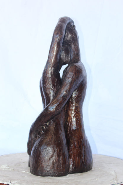 Lovers embracing one another bronze statue -  Size: 13"L x 10"W x 24"H.