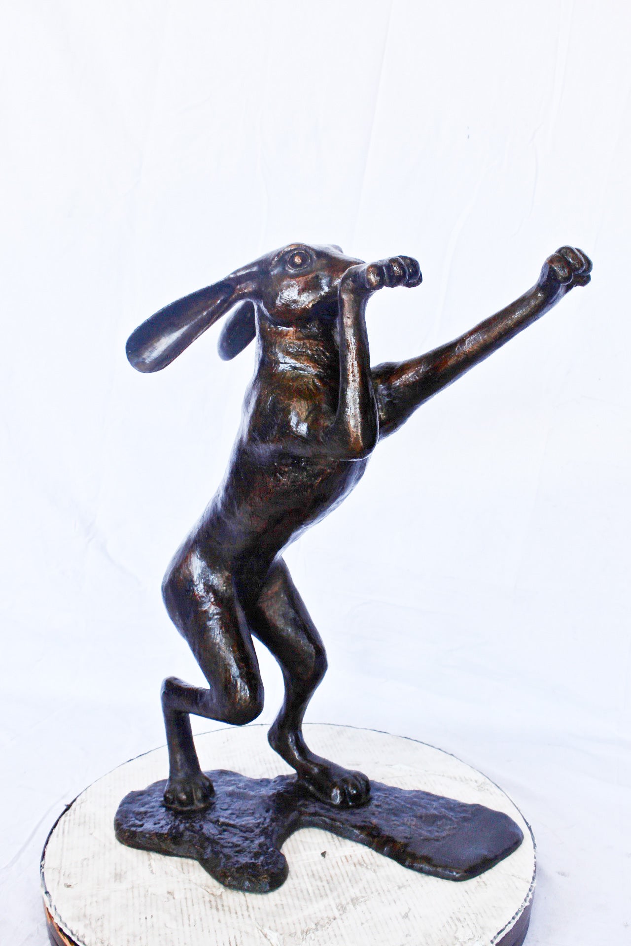 Leaping jackrabbit bronze statue -  Size: 21"L x 13"W x 24"H.
