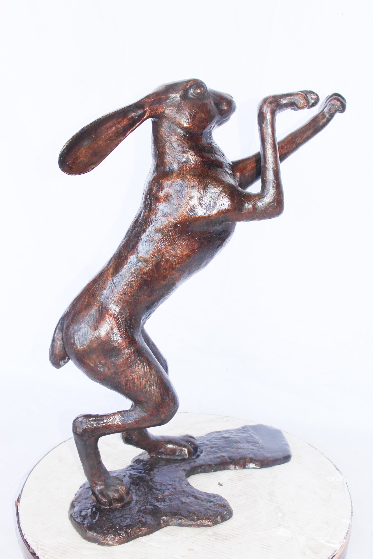 Leaping jackrabbit bronze statue -  Size: 21"L x 13"W x 24"H.