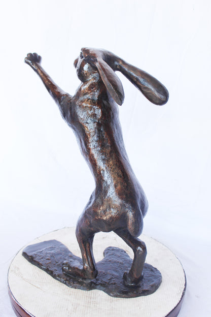 Leaping jackrabbit bronze statue -  Size: 21"L x 13"W x 24"H.