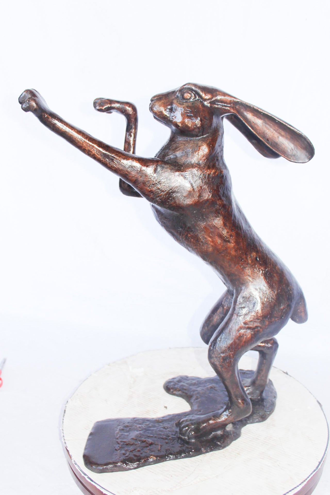 Leaping jackrabbit bronze statue -  Size: 21"L x 13"W x 24"H.