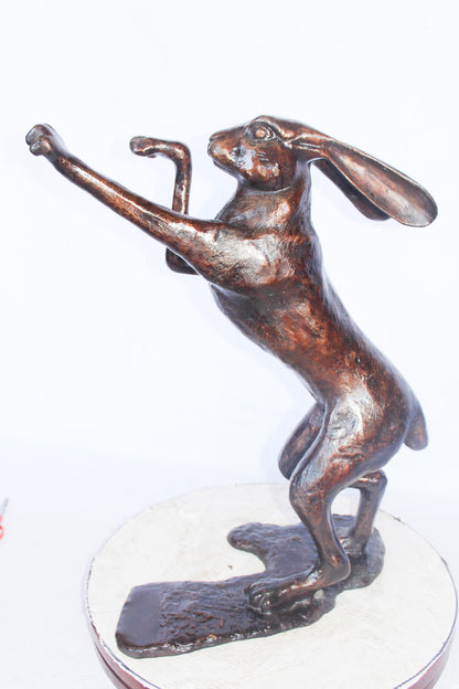 Leaping jackrabbit bronze statue -  Size: 21"L x 13"W x 24"H.