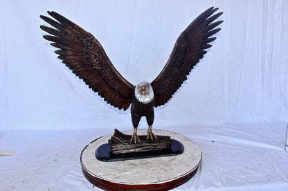 Perched eagle bronze statue -  Size: 35"L x 21"W x 29"H.