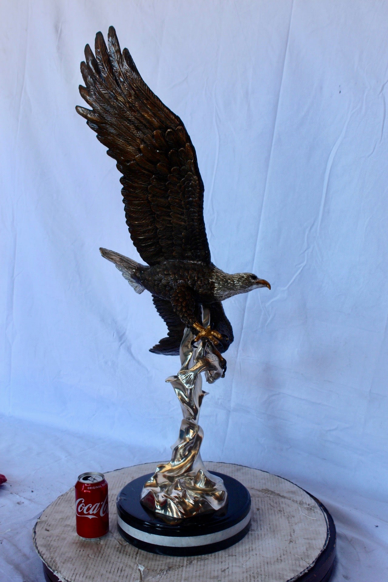 Soaring eagle carrying prey bronze statue -  Size: 16"L x 23"W x 39"H.
