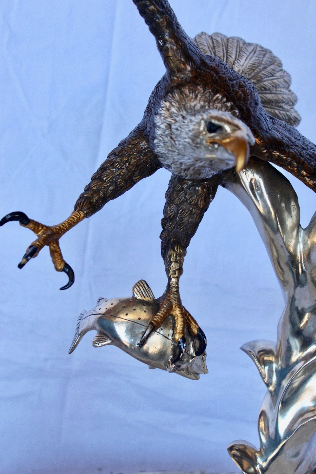 Soaring eagle carrying prey bronze statue -  Size: 16"L x 23"W x 39"H.