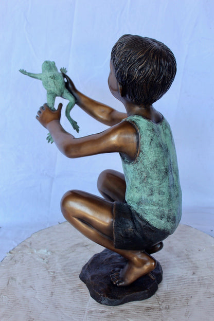 Young boy holding a frog bronze statue fountain -  Size: 18"L x 10"W x 22"H.