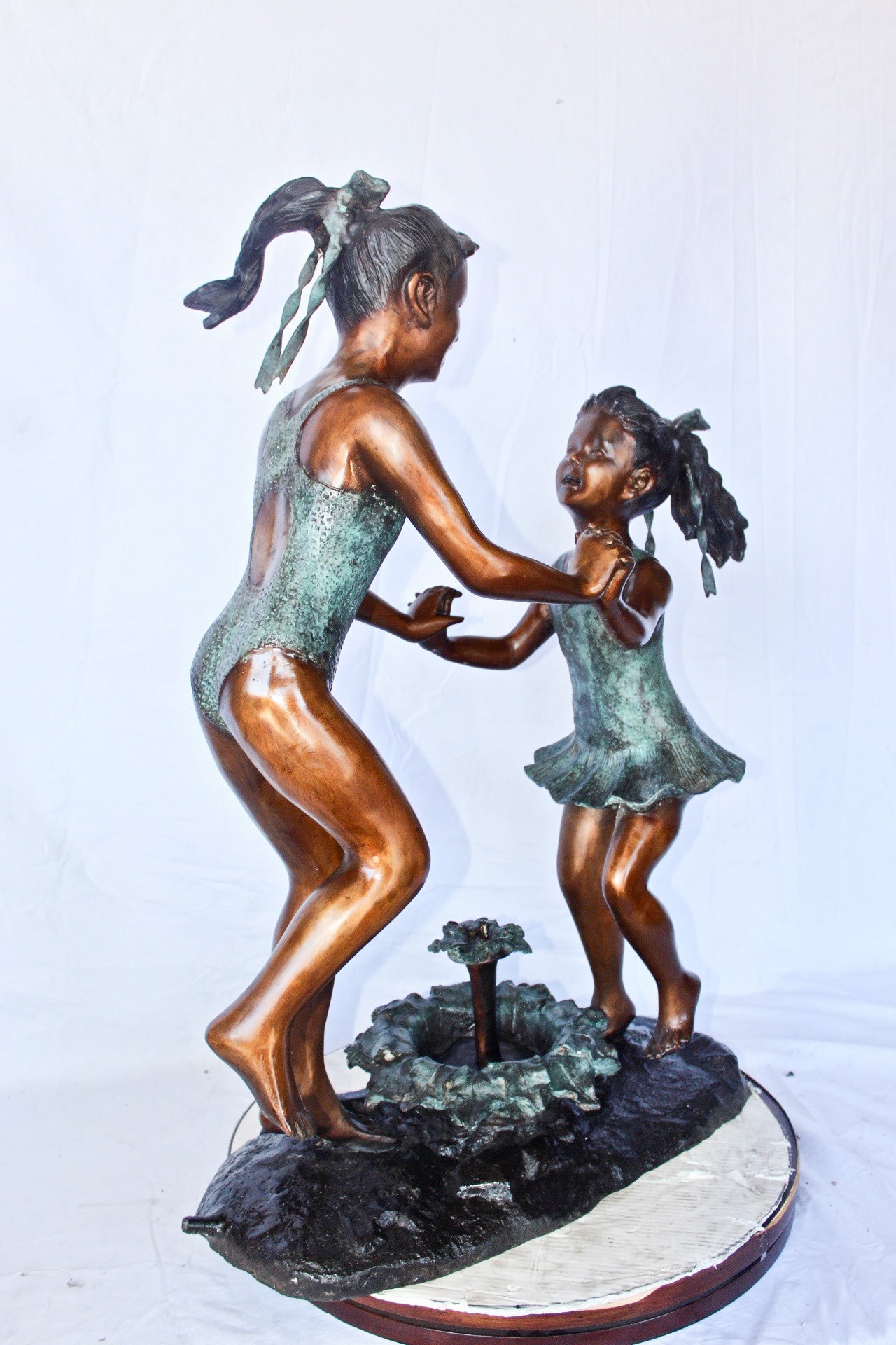Young dancing girls circling fountain bronze statue -  Size: 14" x 29" x 38"H.