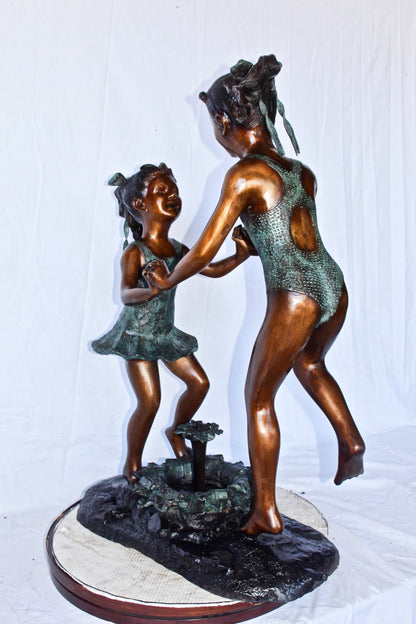 Young dancing girls circling fountain bronze statue -  Size: 14" x 29" x 38"H.