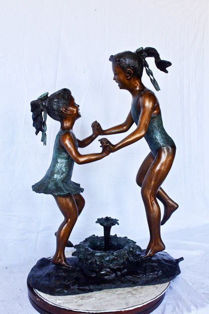Young dancing girls circling fountain bronze statue -  Size: 14" x 29" x 38"H.
