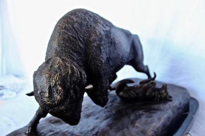 Charging bison v. Wolves bronze statue -  Size: 36"L x 17"W x 17"H.