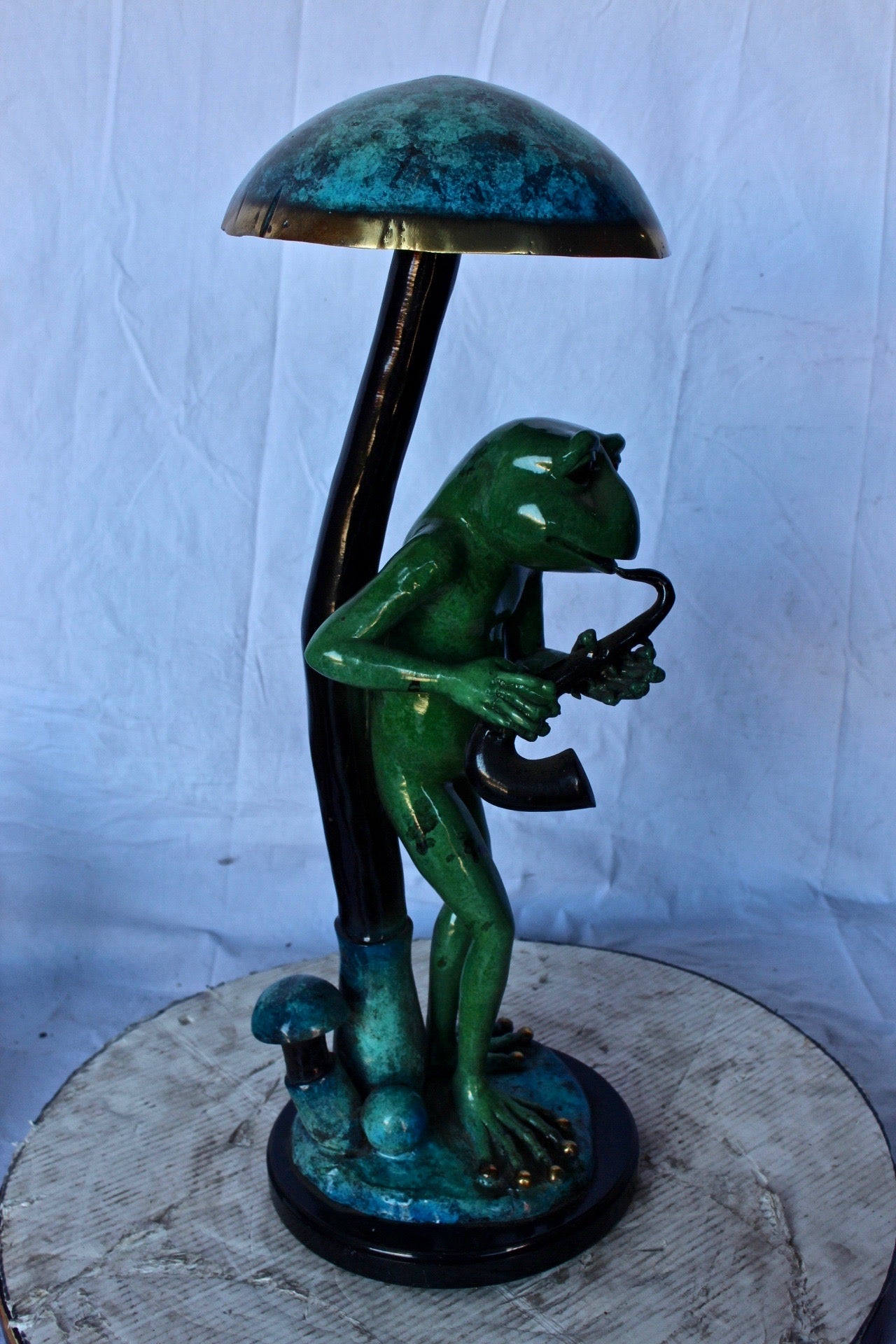 Jazzy frog perched under mushroom bronze statue   -  Size: 10"L x 10"W x 28"H.