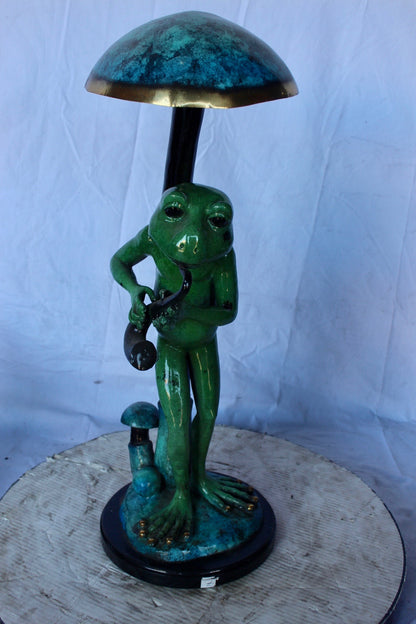Jazzy frog perched under mushroom bronze statue   -  Size: 10"L x 10"W x 28"H.
