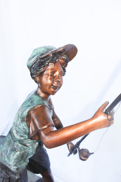 A young boy and his fishing journey bronze statue -  Size: 24"L x 26"W x 47"H.