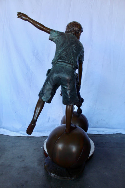 Boy and poodle balancing circus stars bronze statue -  Size: 38" x 27" x 55"H.