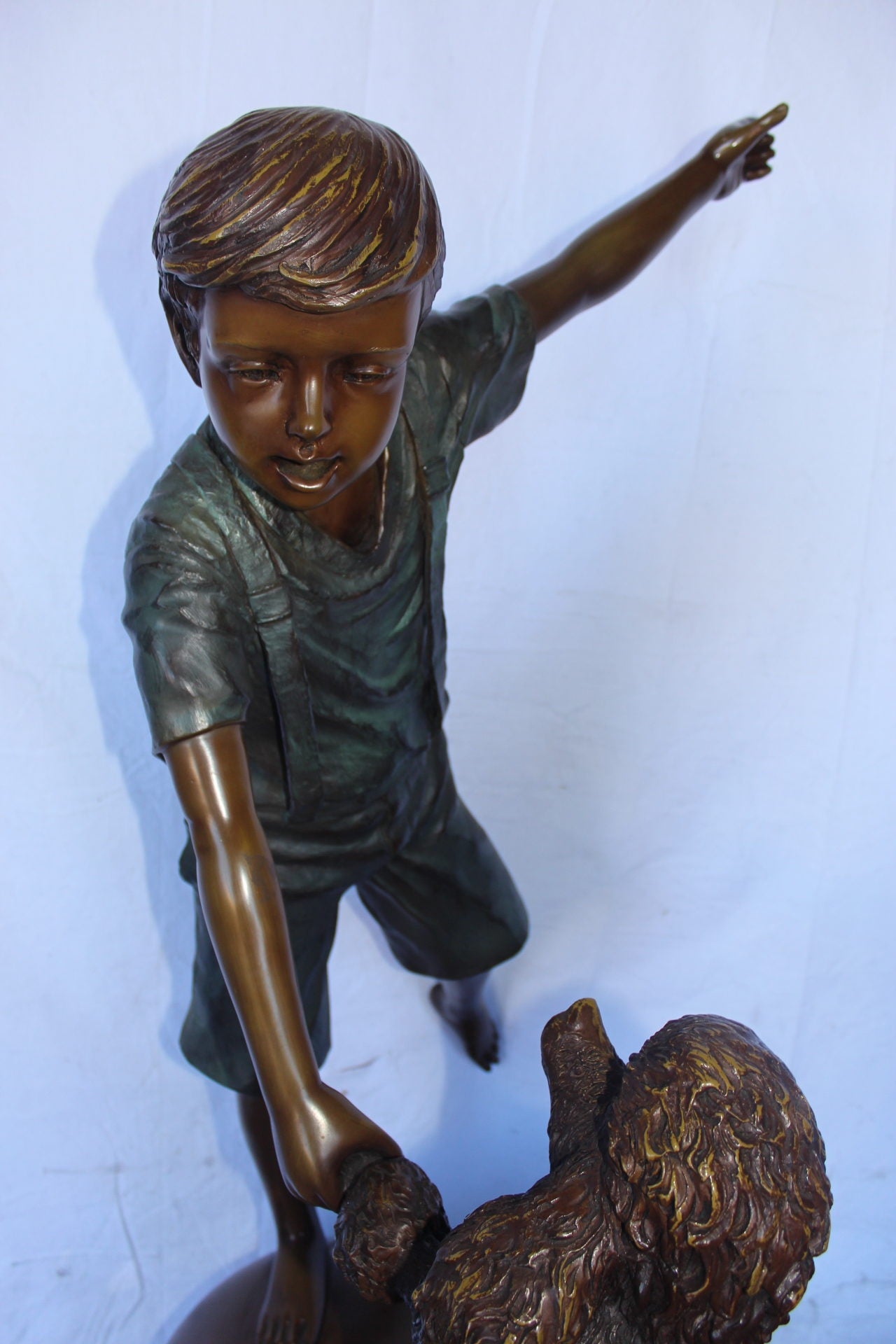 Boy and poodle balancing circus stars bronze statue -  Size: 38" x 27" x 55"H.